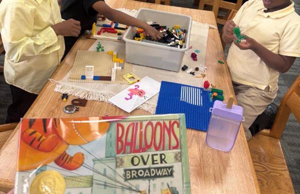 students with book in library